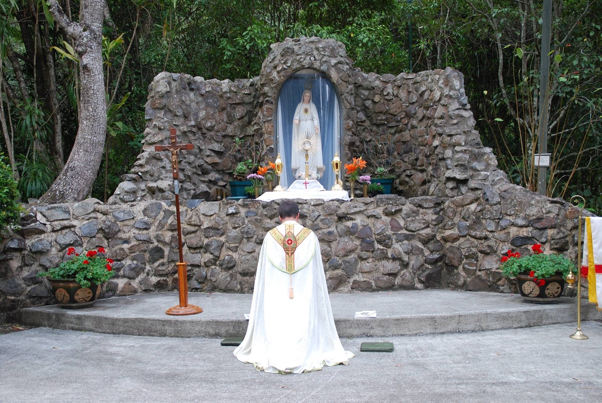 Fr. Albert leading devotions at the Fatima Grotto.